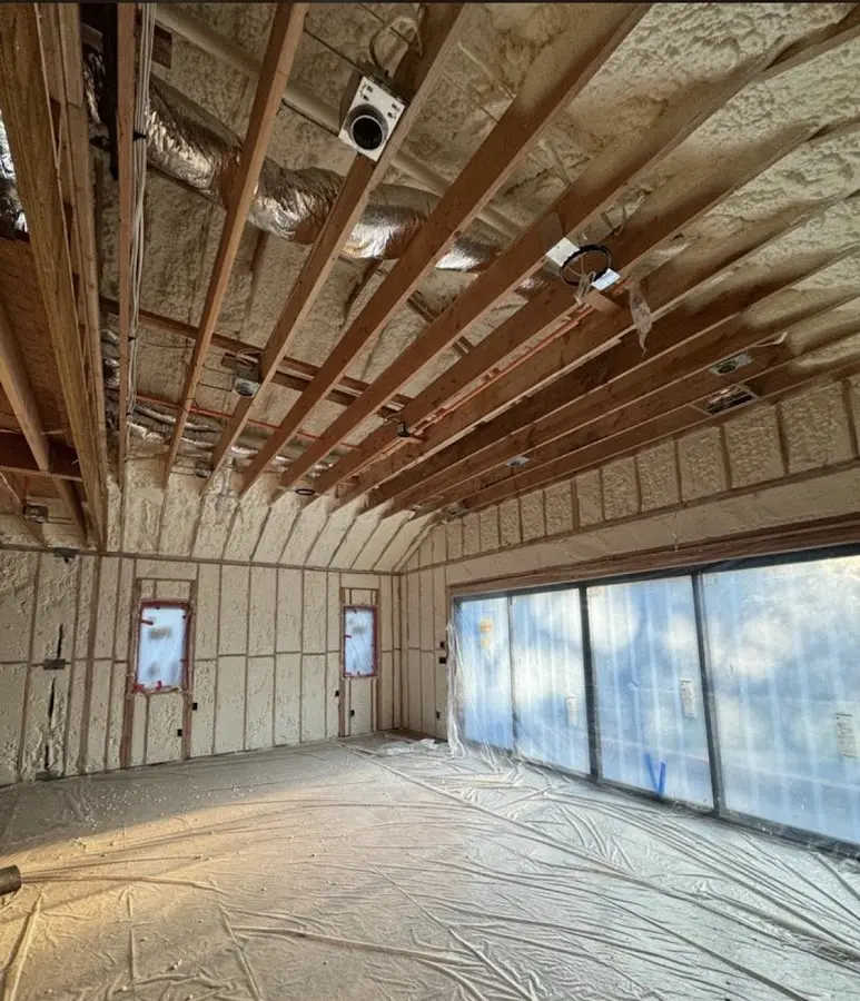 Interior walls and ceiling insulated with spray foam during new construction in East Greenwich